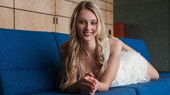 Woman dress blondes couch smiling white dress models lying down 