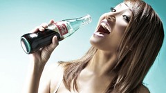 Woman drinks coca-cola brunettes