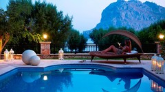 Woman drinks sitting swimming pools