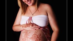 Woman earrings blondes smiling closed eyes pregnant Henna pink 