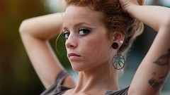 Woman earrings tattoos piercings redheads