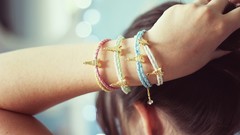 Woman Eiffel Tower hands close-up bracelets brunettes hair up