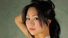 Woman faces asians black hair arms raised