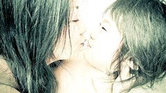 Woman faces asians kissing artwork