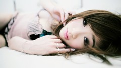 Woman faces asians lying down