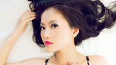 Woman faces asians lying down