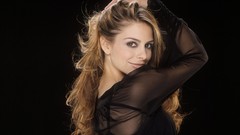 Woman faces black background