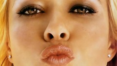 Woman faces blondes kissing