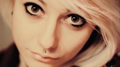 Woman faces blondes piercings self-portrait