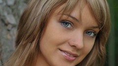 Woman faces blue eyes