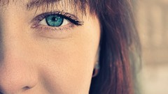Woman faces blue eyes
