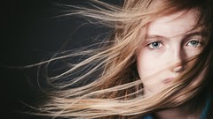 Woman faces blue eyes