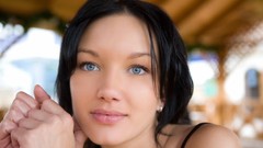 Woman faces blue eyes black hair Loreen A