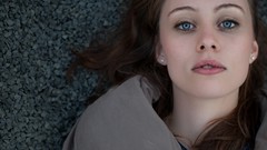 Woman faces blue eyes brunettes lying down