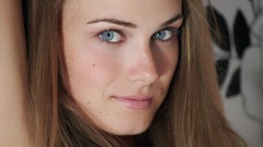 Woman faces blue eyes brunettes models arms raised 