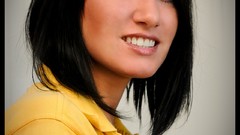 Woman faces blue eyes yellow dress