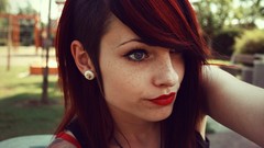 Woman faces bokeh earrings outdoors tattoos freckles piercings 
