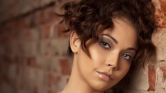 Woman faces brunettes brick wall