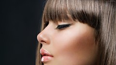 Woman faces closed eyes