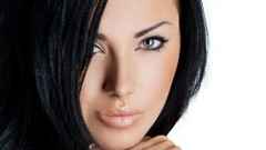 Woman faces green eyes black hair