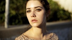 Woman faces green eyes brunettes blurred background