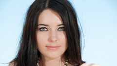 Woman faces green eyes freckles models black hair