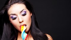Woman faces lollipops
