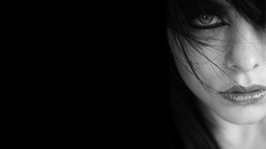 Woman faces monochrome artwork