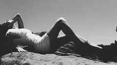 Woman faces monochrome legs outdoors models lying down
