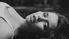 Woman faces monochrome lying down