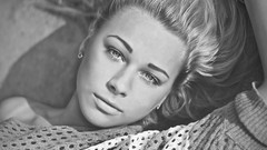 Woman faces monochrome lying down