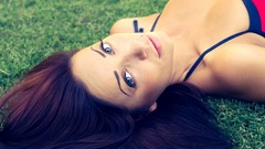 Woman faces outdoors blue eyes brunettes lying down bikini 