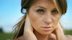 Woman faces outdoors blue eyes freckles