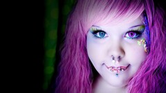 Woman faces piercings purple hair