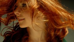 Woman faces redheads hair toss