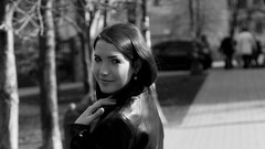 Woman faces smiling models Leather Jacket looking back 