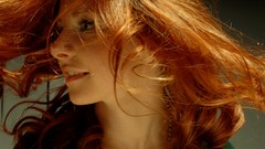 Woman faces smiling redheads