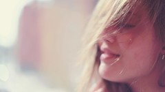 Woman faces sunlight