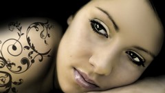Woman faces tattoos