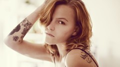 Woman faces tattoos piercings