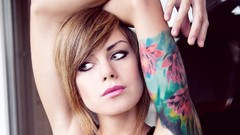 Woman faces tattoos short hair