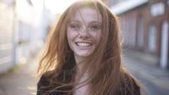 Woman faces urban smiling redheads