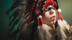 Woman feathers face paint head dress Native American