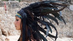 Woman feathers Indians outdoors brunettes head dress