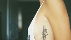 Woman feathers tattoos boobs sideboobs