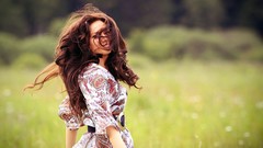 Woman fields brunettes summer dress looking back hair in face