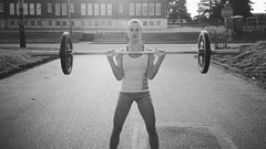 Woman fitness rack weight lifting