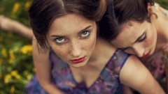 Woman freckles looking up depth of field eyeliner