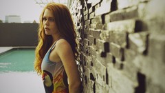 Woman freckles redheads brick wall