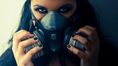 Woman gas masks away